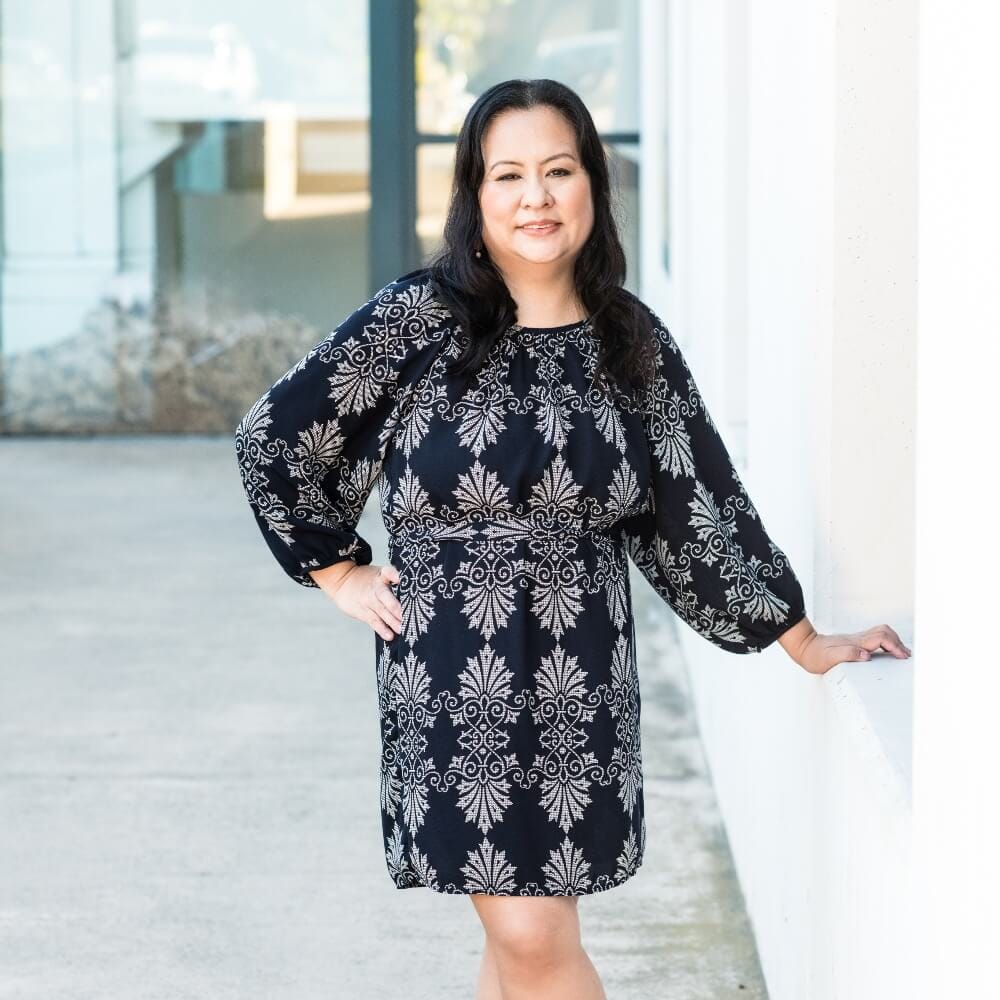 Frances Go standing by San Diego H Museum