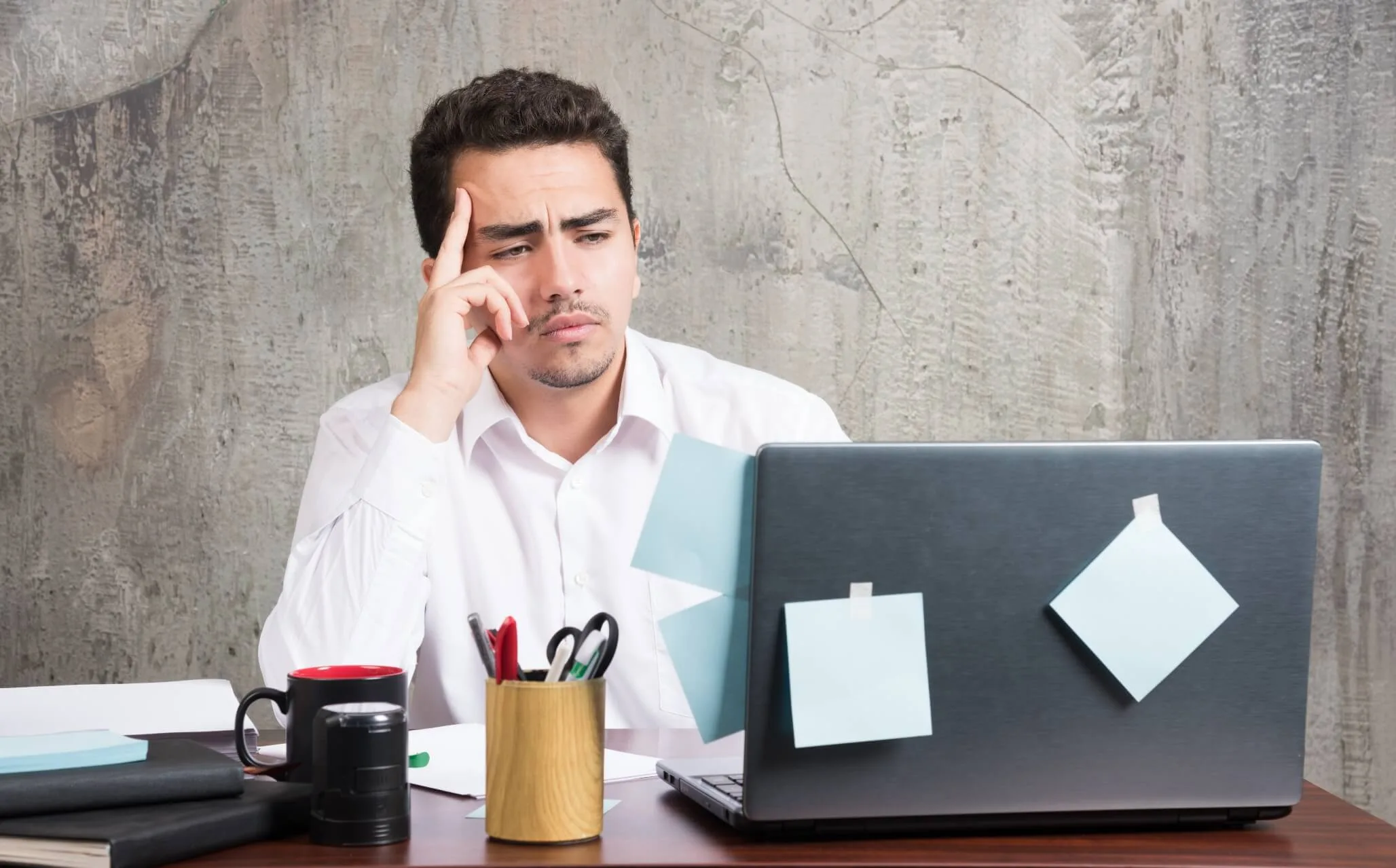 businessman looking laptop office desk